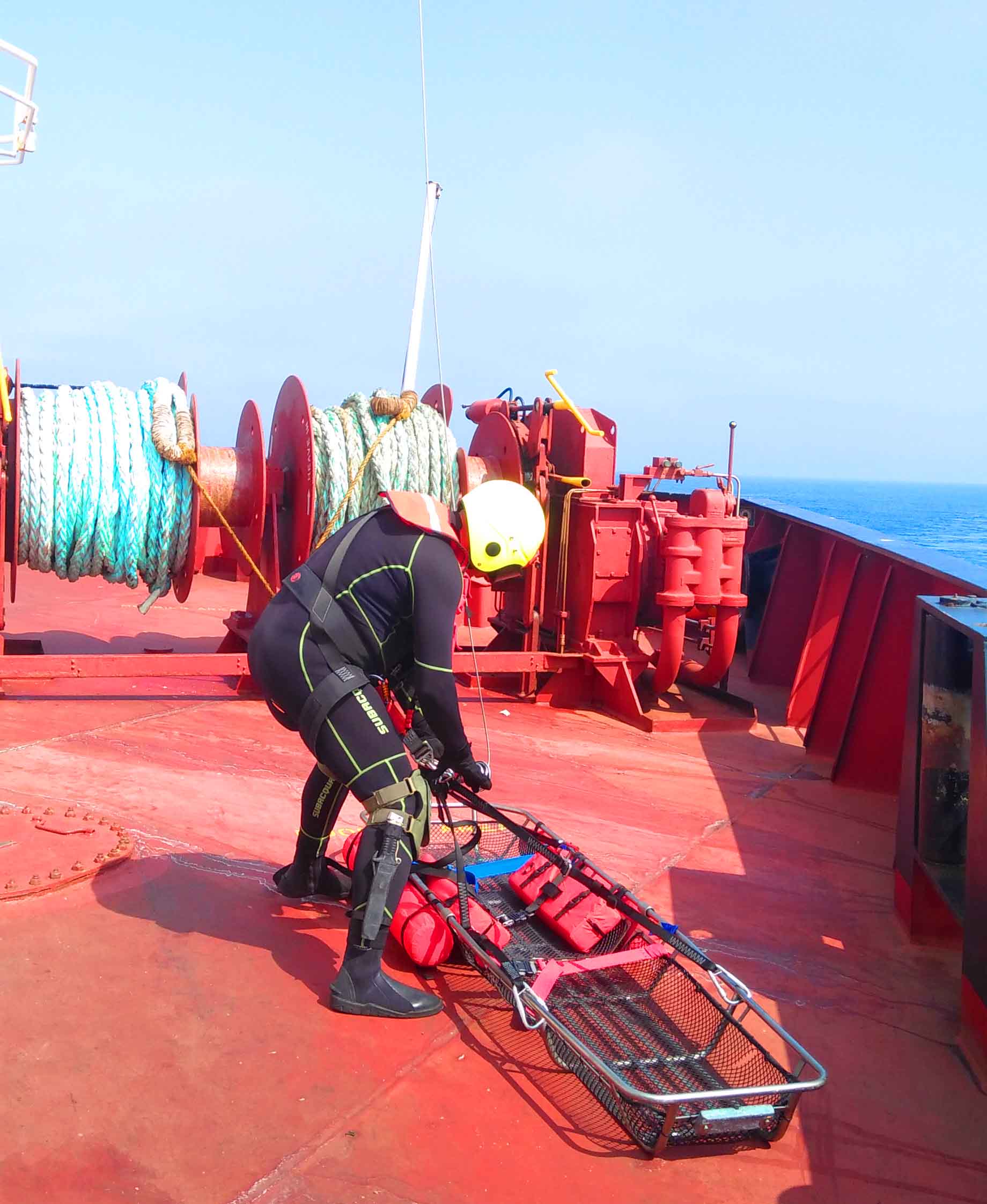 Portuguese Navy Officer conducting a landing from a helicopter on the ship's poop deck.