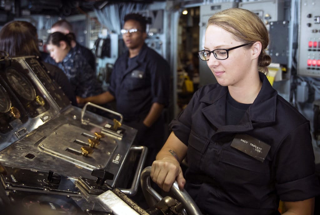 Sailor simulates helmsman watch in the bridge during a fast cruise aboard USS Wasp.