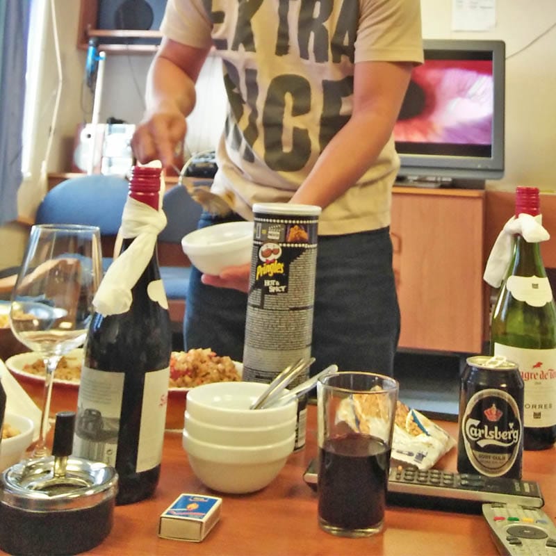 Beer, Pringles, wine, and other snacks on the table.