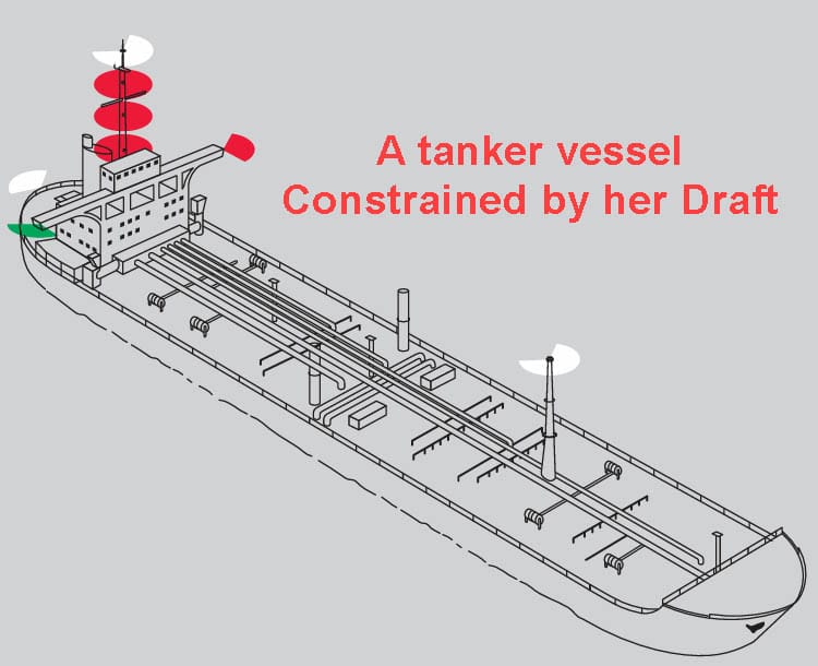 A tanker vessel showing three red lights in addition to its navigational lights indicating she is constrained by her draft.